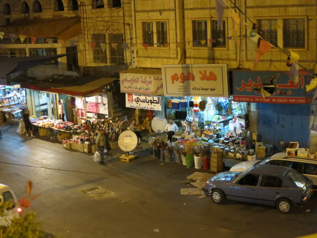 Shopkeeper sitting outside his shop